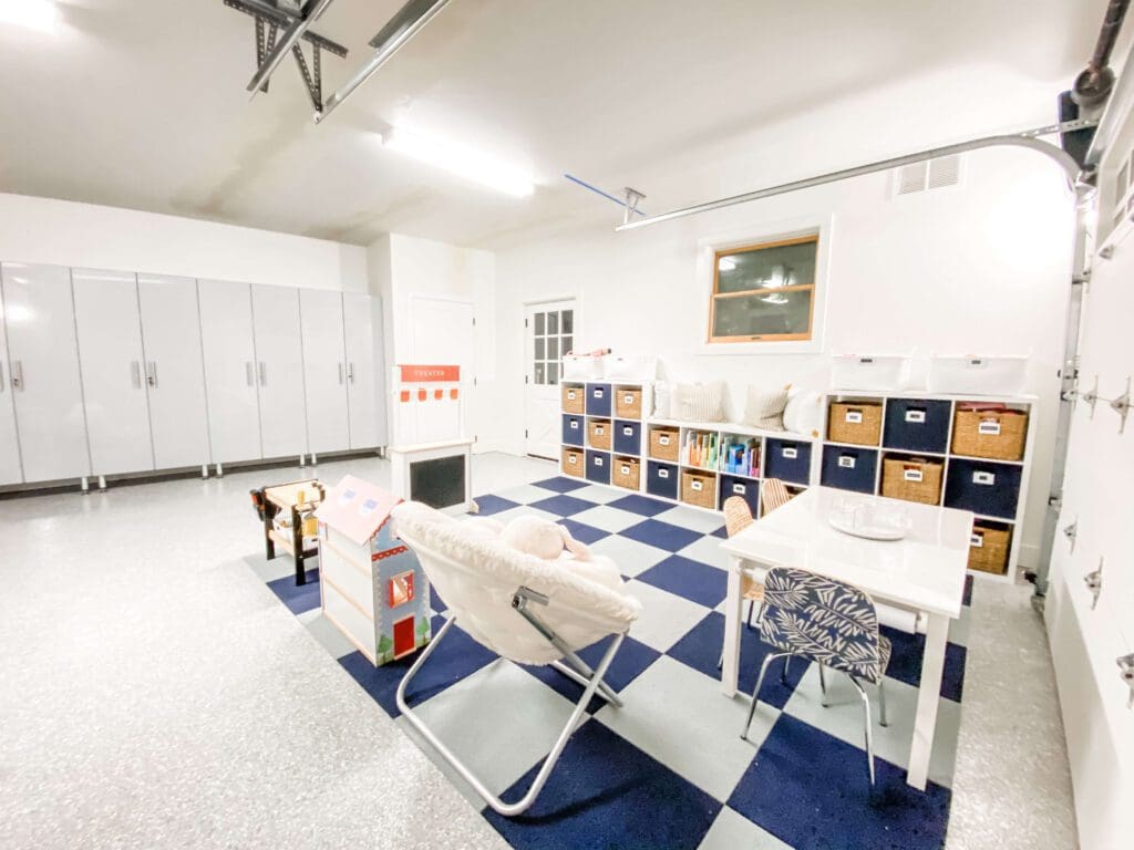 Bright, organized classroom with blue and white checkered floor and individual desks.