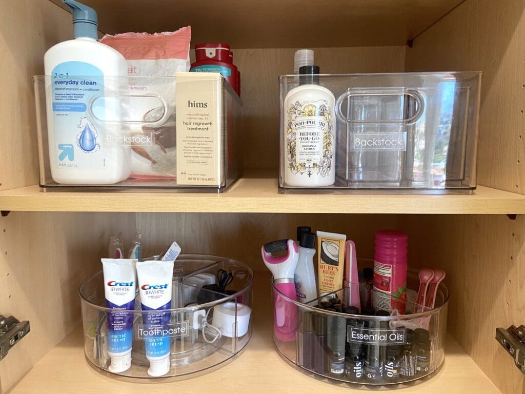 Organized bathroom shelves with skincare and personal care products.