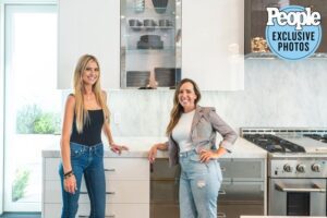 Two Women Posing in a Kitchen Space