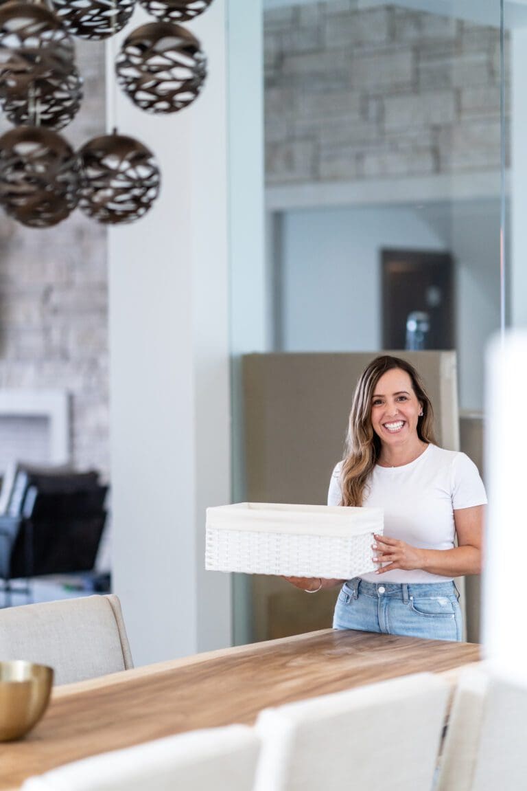 Simply Luxe organizer holding a white storage basket in a bright home