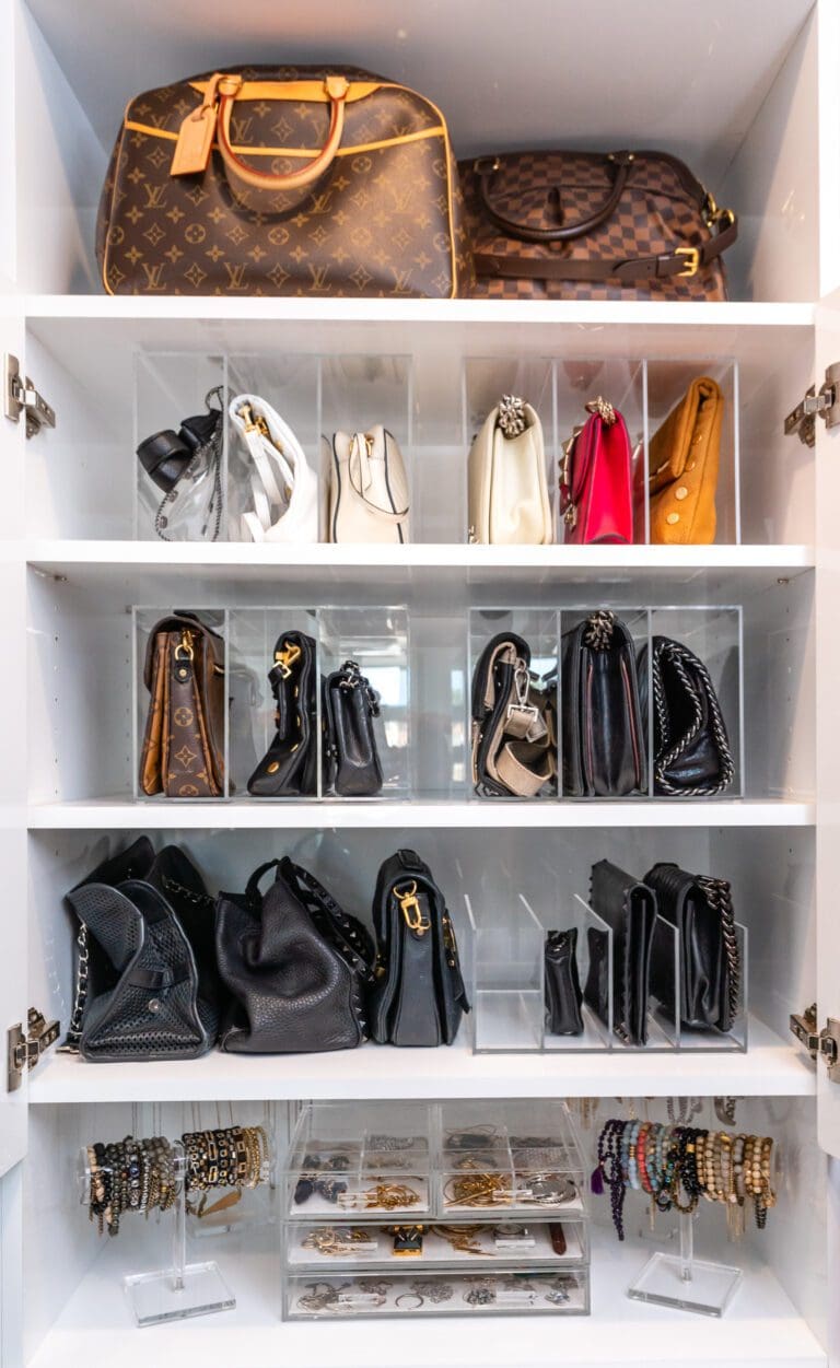 White closet shelves with handbags and accessories neatly displayed