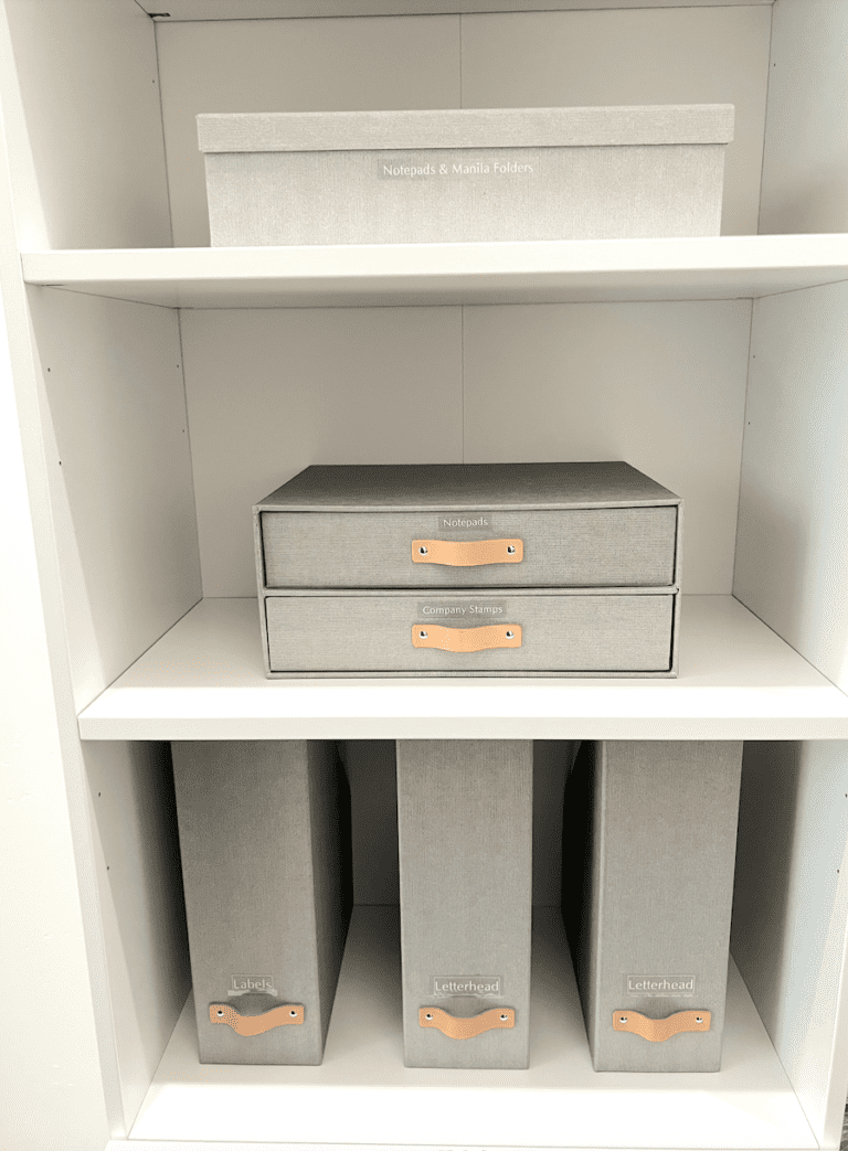 White office shelves with matching linen file boxes and magazine holders