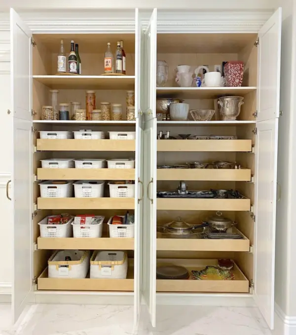 Pantry cabinet with labeled containers and jars organized by Simply Luxe