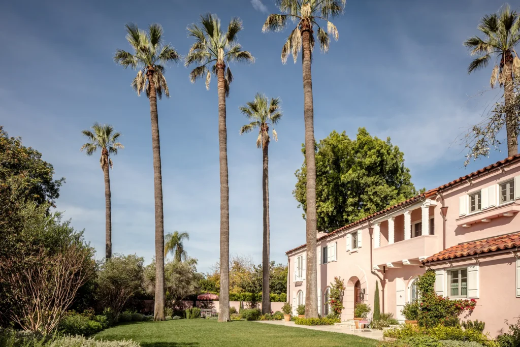 Image may contain Palm Tree Plant Tree Architecture Building House Housing Villa Grass Vegetation and Summer