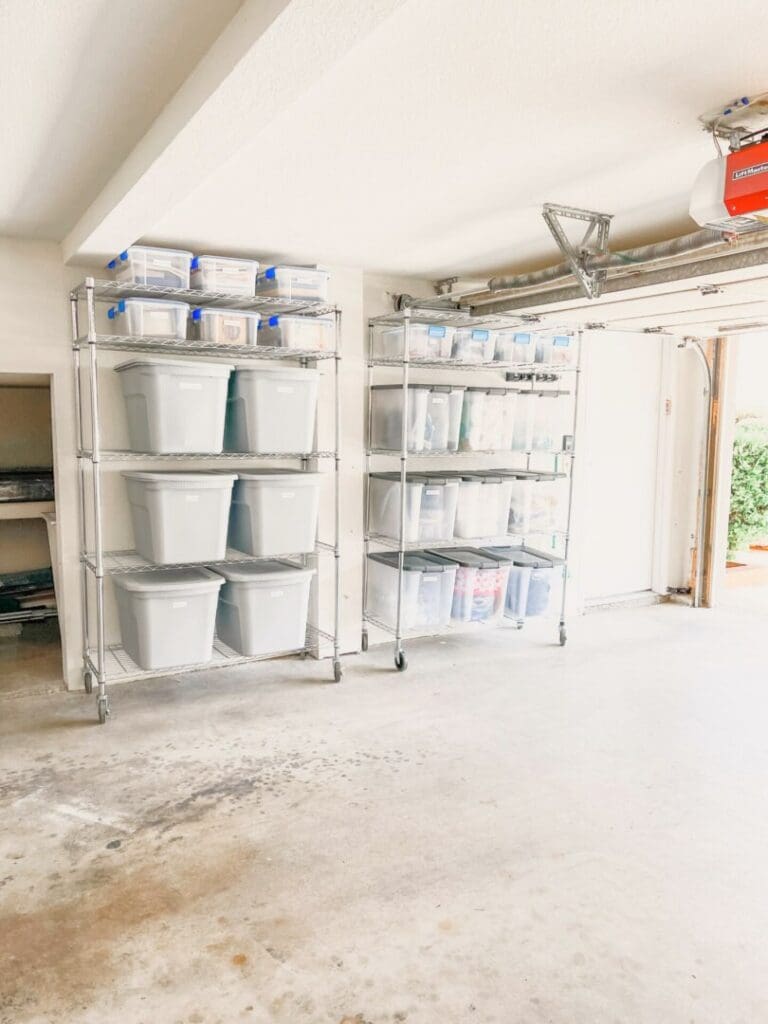 Organized garage with clear labeled storage bins on metal shelving