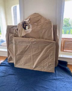 Large artwork wrapped in brown paper and padding, ready for the movers, Orange County