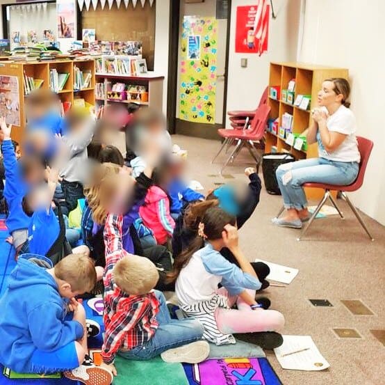 Ryen Toft reading Bee A Dreamer to first- and second-graders in the library at Ramona Elementary School in Ramona