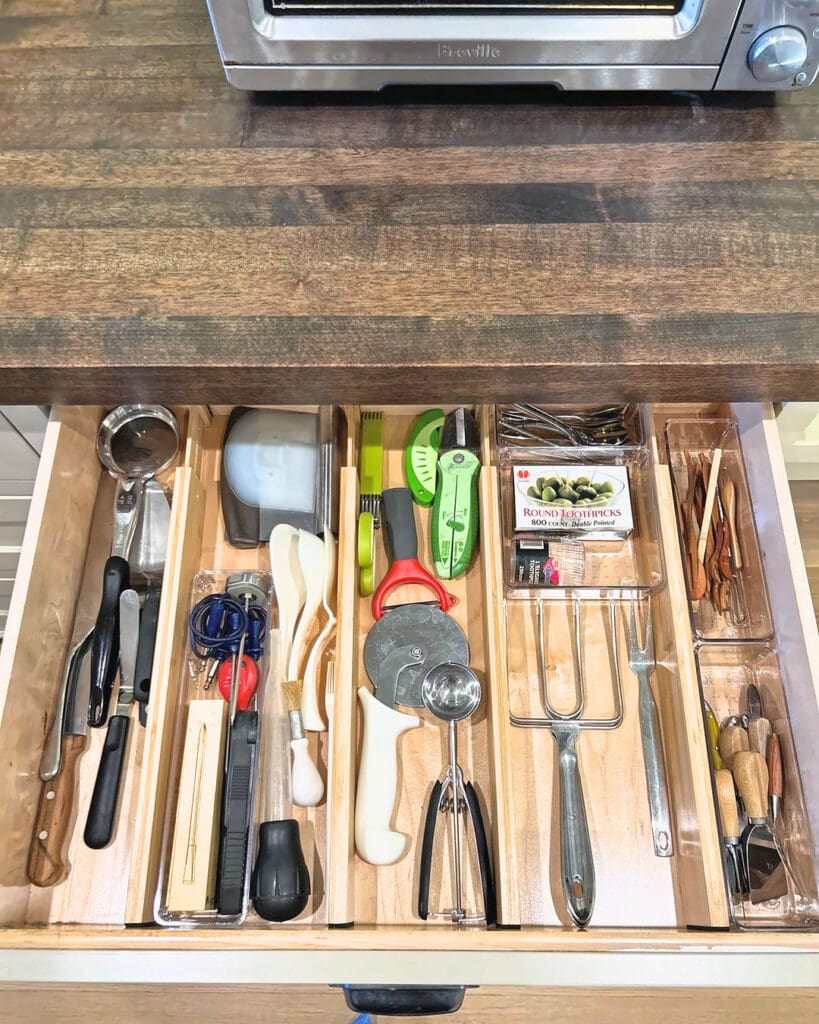 Kitchen utensil drawer in Del Mar organized with wood dividers by the Simply Luxe team