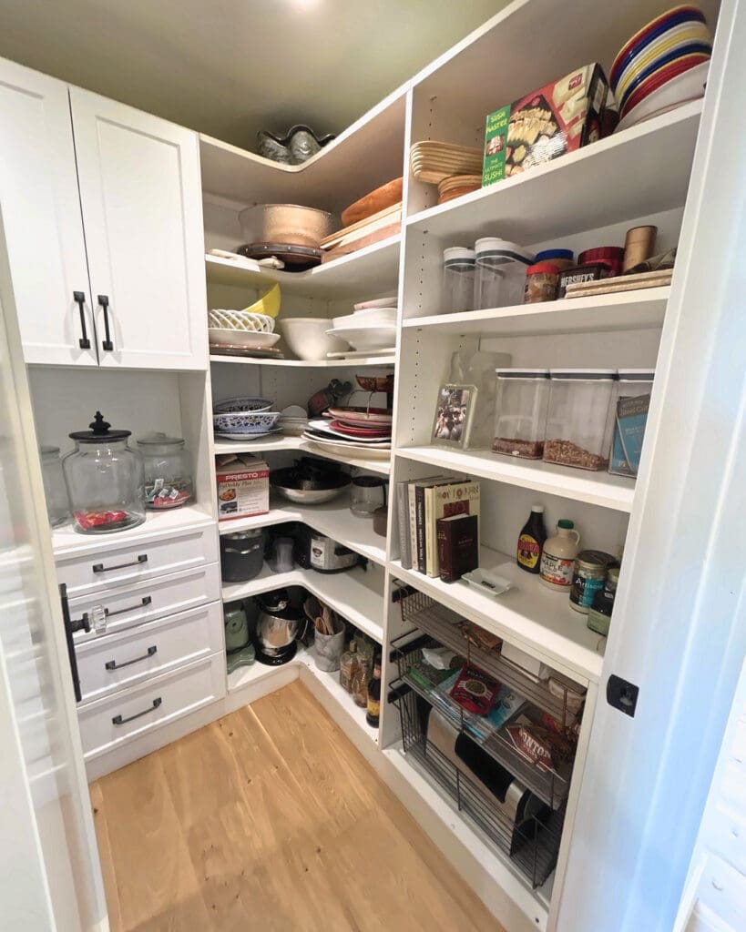 Walk-in pantry in Del Mar organized by the Simply Luxe team with labeled zones and open shelving