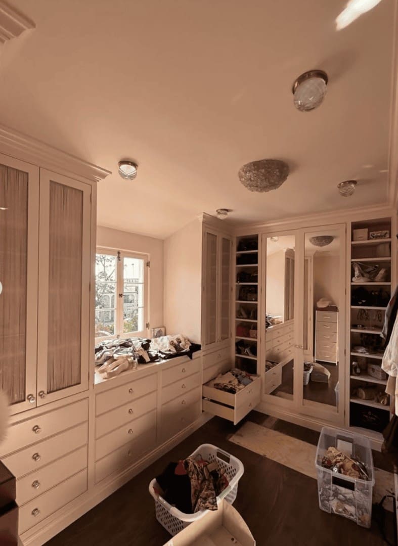 Luxury walk-in closet with cream custom cabinetry mid-organization by Simply Luxe for Eileen Kelly Vogue home