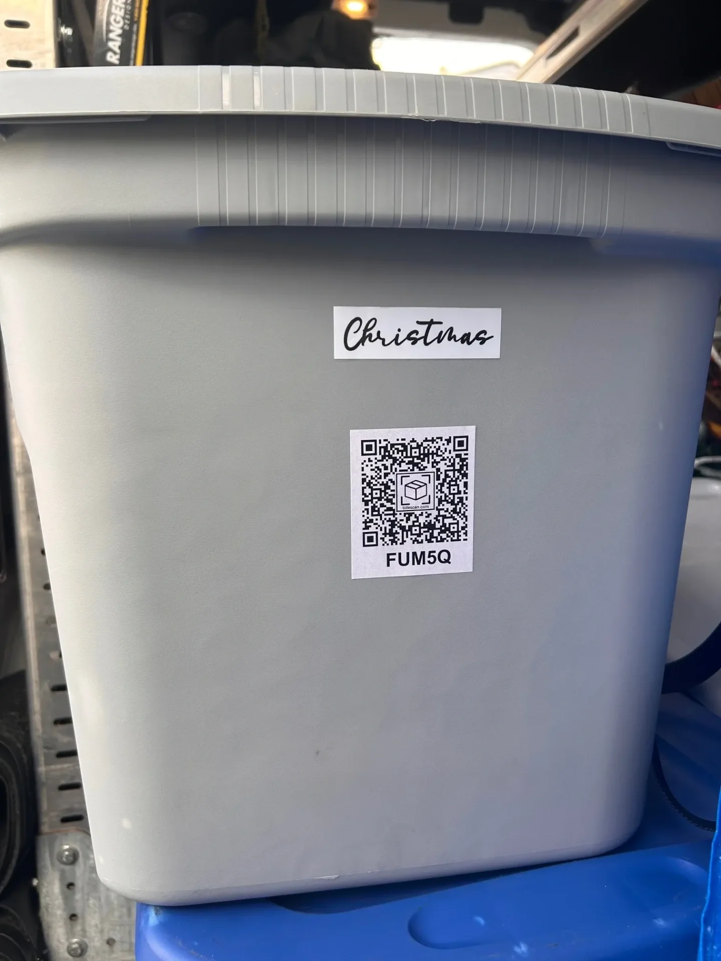 Gray bin labeled "Christmas" with QR code.