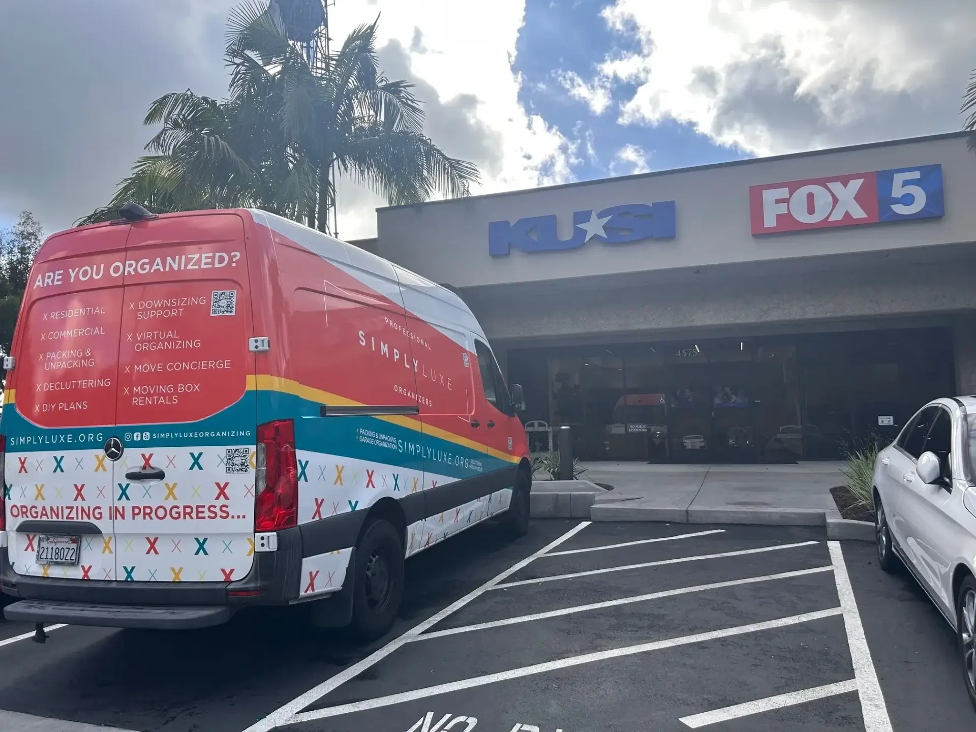 Organizing van parked outside TV station.