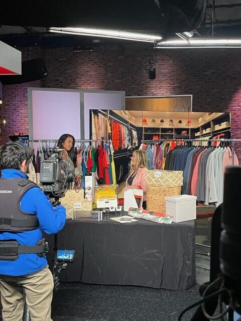 FOX 5 studio television studio filled with clothes and being filmed