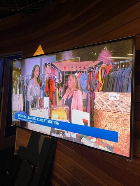FOX 5 studio woman showing clothes to another woman on tv