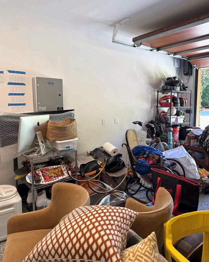 Packed two car garage before organizing, Del Mar home