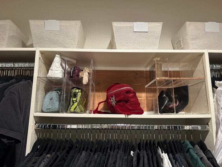 Handbags standing in clear acrylic dividers on a shelf in Katie Maloney's celebrity closet in Los Angeles