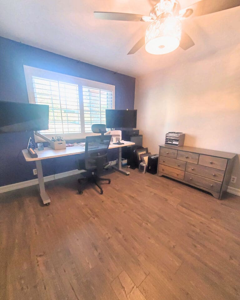 Home office after organizing: clear standing desks, open floor and a tidy dresser for supplies, Los Angeles