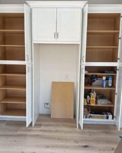 Empty kitchen built ins wiped down and ready to be filled during a move, San Diego