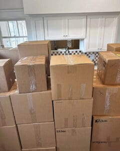 Kitchen stacked to the cabinets with moving boxes on move in day, Orange County