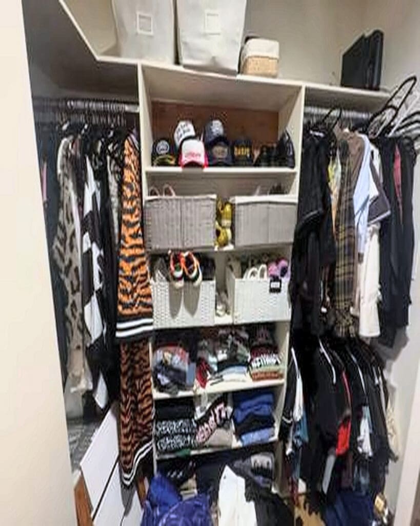 Men's walk-in closet before organizing in a celebrity client home, Los Angeles
