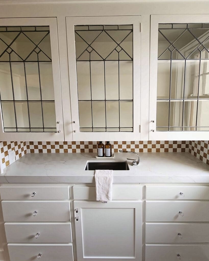 Butler pantry with leaded glass cabinets before unpacking, shelves bare after the move, Orange County home