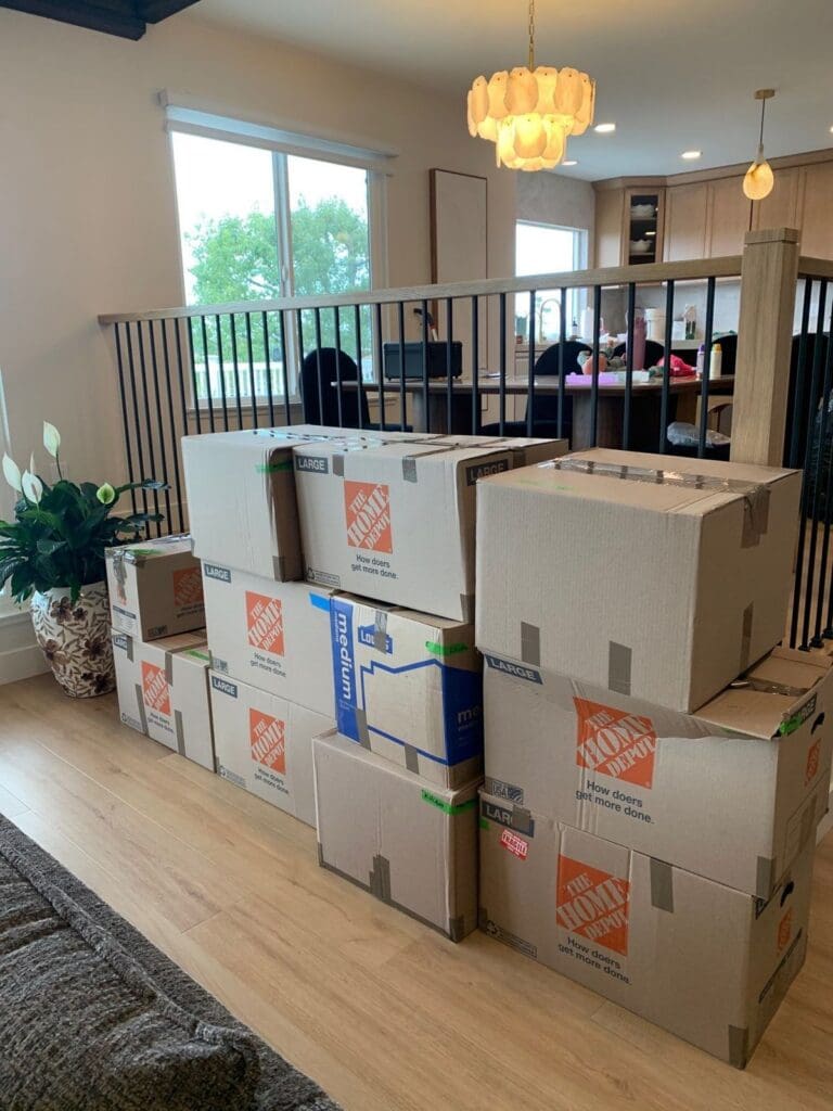 Stacks of moving boxes waiting to be unpacked after a home remodel in Mission Viejo