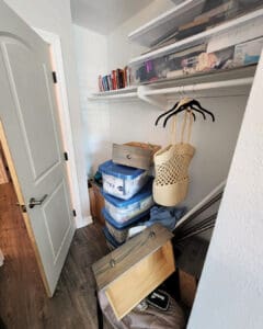 Office closet before organizing with overflowing bins, loose drawers and bags on the floor, Los Angeles