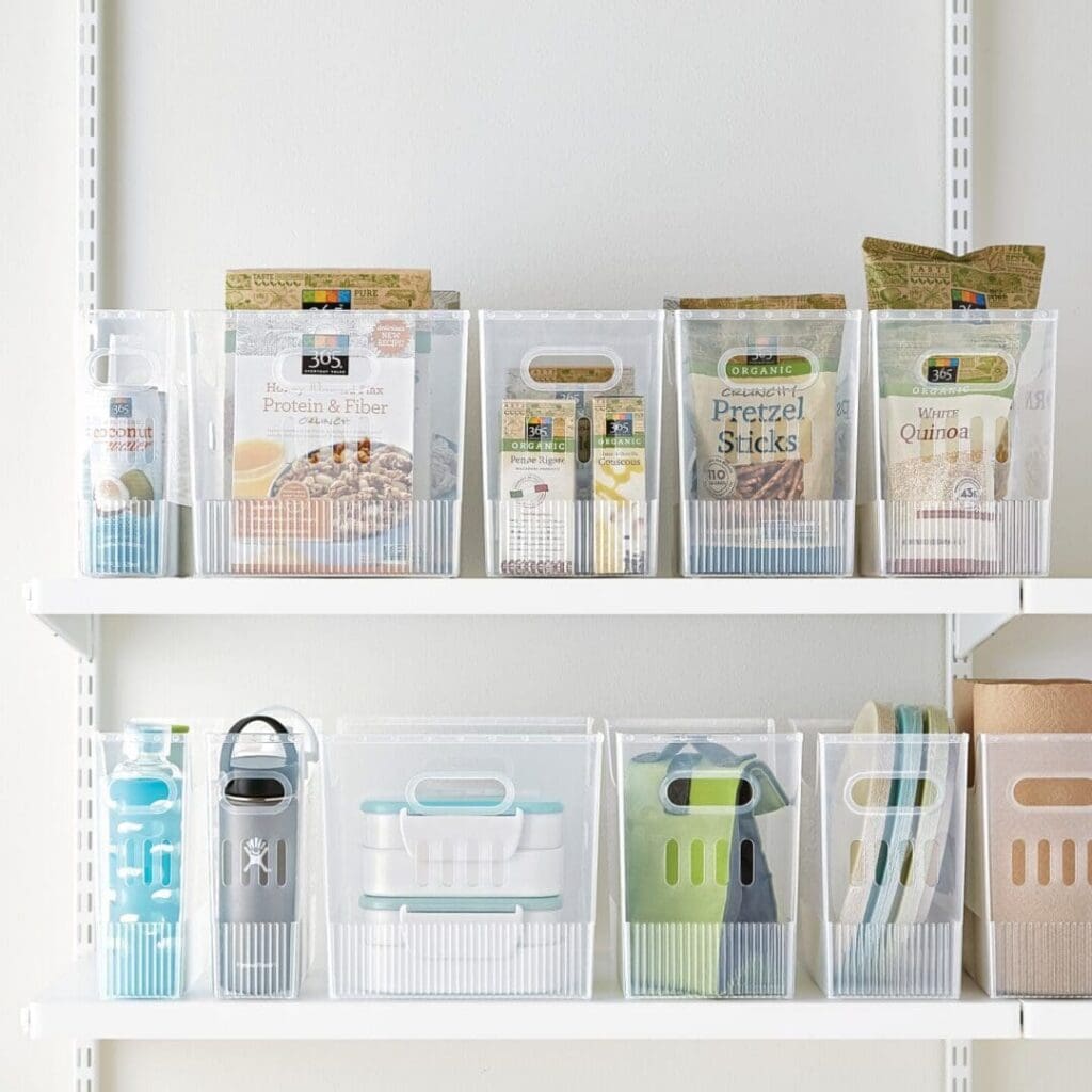 Woman smiling while organizing colorful wallets in a closet.