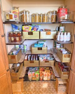 Pantry after unpacking, with jars, baskets and snack bins on every shelf, Newport Beach