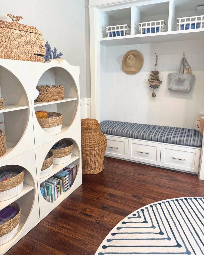 Playroom after Simply Luxe organizing, with woven baskets in round cubbies and a styled window seat, Los Angeles