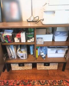 Printer shelf after organizing with supplies sorted into bins and baskets, San Diego