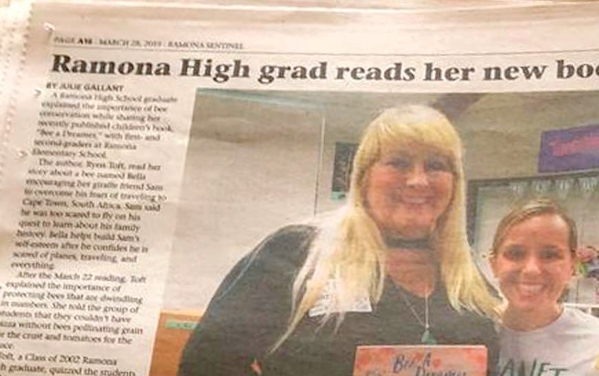 Ramona Sentinel clipping, March 28, 2019: Ramona High grad reads her new book to students, with a photo of Ramona Elementary parent Angela Jauregui and author Ryen Toft holding copies of Bee A Dreamer