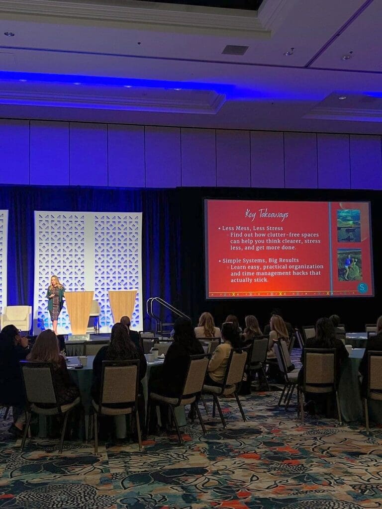 Ryen Toft speaking to 250 MGM executives in a Las Vegas ballroom, seen from the audience