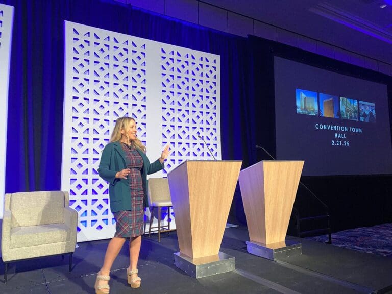 Ryen Toft speaking on stage as the headline speaker for 250 MGM executives in Las Vegas
