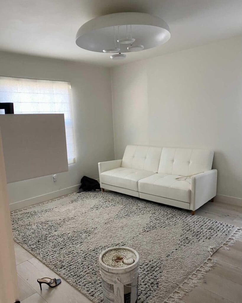 Empty spare bedroom with a white sofa in La Jolla before it became a custom dressing room closet