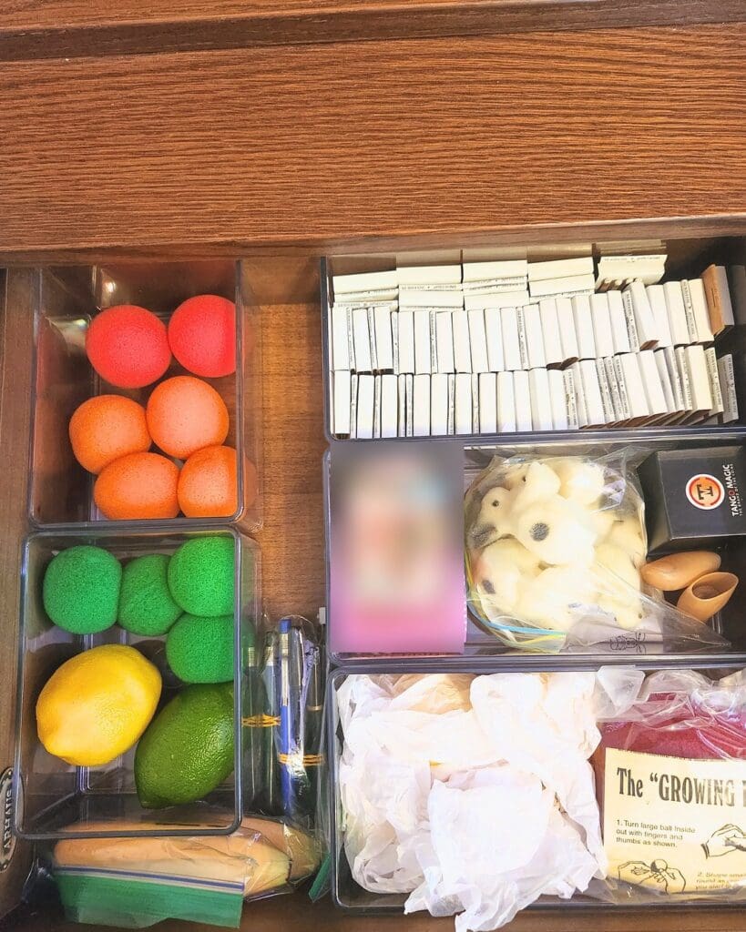 Home office supply drawer after organizing, every item sorted into clear bins by type, San Diego
