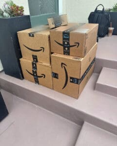 Delivery boxes stacked on the front steps of a vacation rental waiting for the owner, San Diego