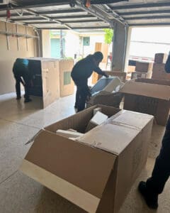 Furniture delivery being unboxed in the garage of a vacation rental, San Diego