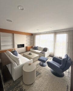 Same vacation rental living room after Simply Luxe setup, sofas, swivel chairs and decor in place, San Diego