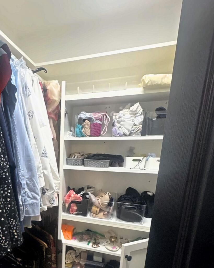 Walk-in closet before organizing, with crowded shelves and mixed items piled in bins, Newport Beach home
