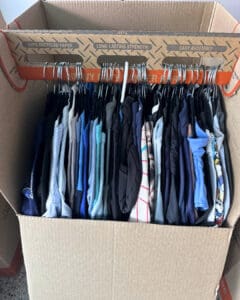 Wardrobe moving box packed with hanging shirts for the move, San Diego
